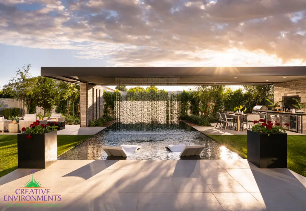 Backyard design with rain curtain into pool.