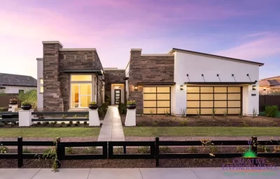 Front yard design with desert plants and real grass.