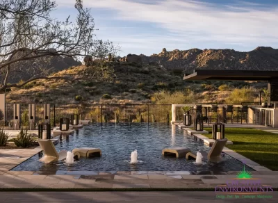 Backyard design with scupper and bubbler water features and baja step.