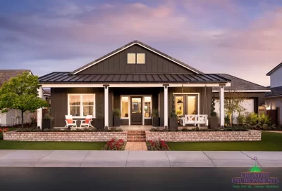 Custom front yard design with brick privacy wall, annuals and multiple seating areas including a hanging front porch swing.