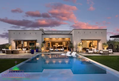Custom backyard design with artificial turf, acrylic pool and baja step.
