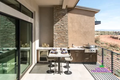 Backyard design with outdoor kitchen, wine fridge and outdoor dining area.